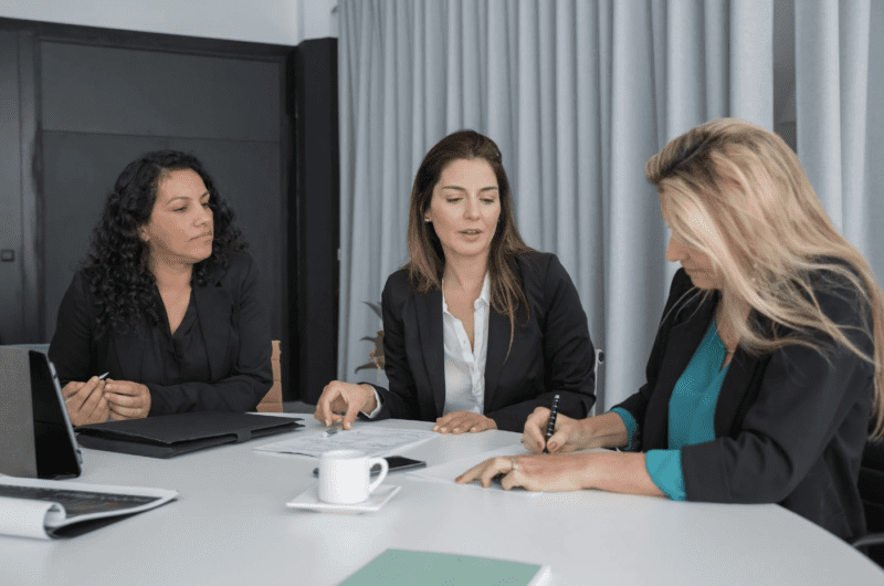 A three women working together in a office. 