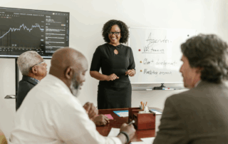 A woman speaking to her team.