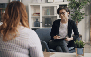 A therapy session, a therapist talking to a client.