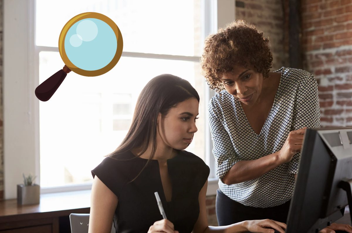 A micromanager looking over their employees shoulder.