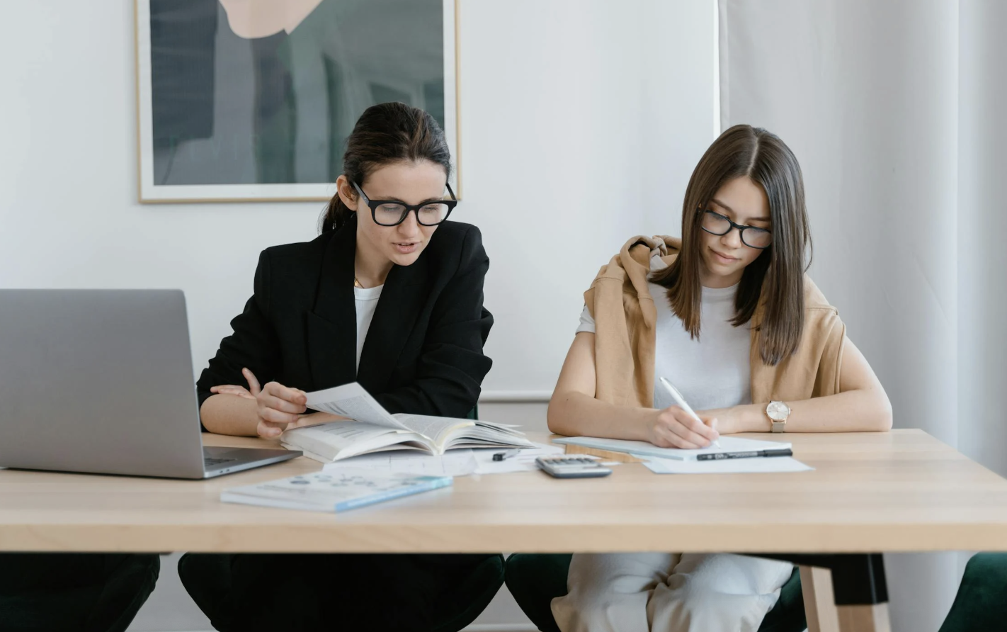 Two business women learning together
