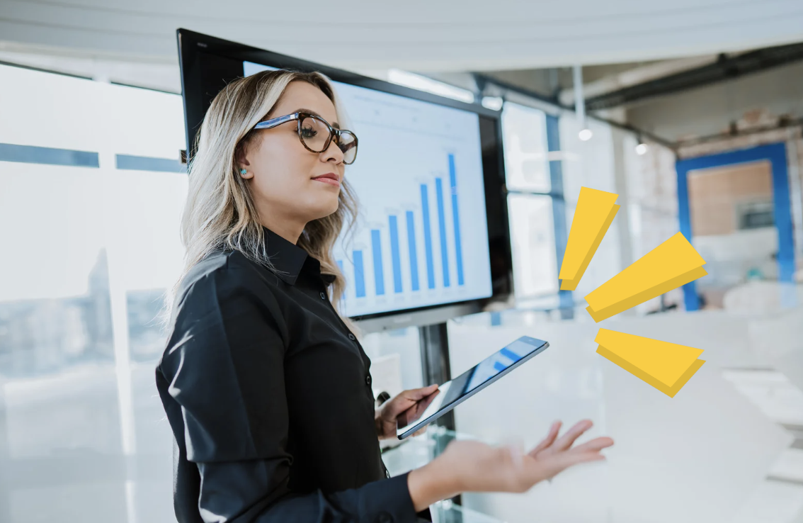 A confident businesswoman giving a presentation, with illustrated lines emphasizing her handheld tablet.