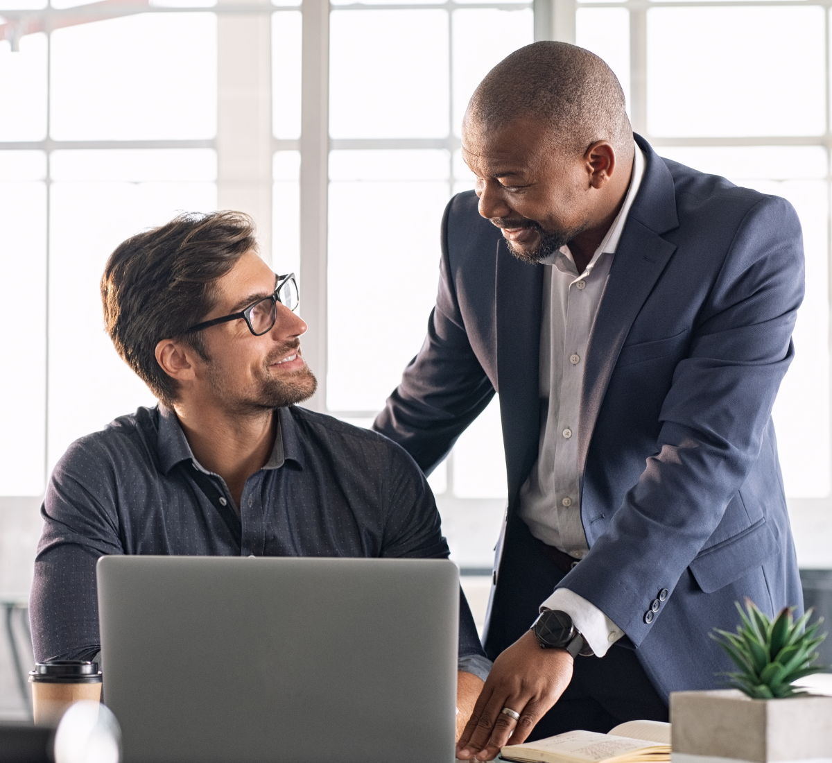 A leader helping a team member.